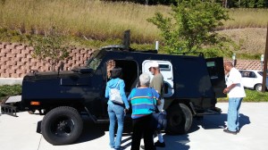 Citizens at the Chapel Hill Public Library view the armored vehicle owned by the Chapel Hill Police Dept., Oct. 4, 2014.