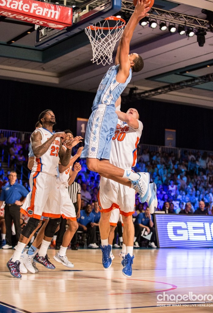 Brice Johnson goes high for a slam against Florida. Photo by Nick Vitali.