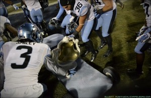 UNC players wasted no time painting the Victory Bell. (Elliott Rubin)
