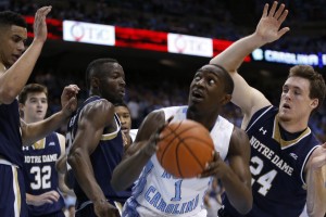 Theo Pinson fights for space inside (Todd Melet)