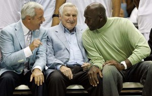 Coach Smith (center) seated with Roy Williams and Michael Jordan (Tar Heel Blog)