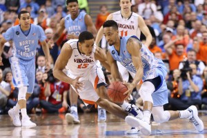 Brogdon fights for the ball with JP Tokoto (Todd Melet)