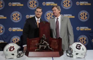 New UNC defensive coordinator Gene Chizik (left) ,shown here during his time at Auburn, has a history with South Carolina head coach Steve Spurrier (right). (Jacksonville.com)