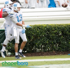 Mack Hollins (13) celebrates with Kendrick Singleton (81). Nazir Jones (90) gets his hand on the football. Photo by Smith Cameron Photography. UNC footballv s Delaware 2015.