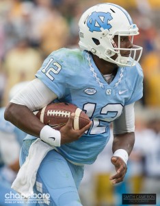 Marquise Williams carries the football. Photo via Smith Cameron Photography.
