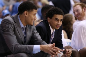 Marcus Paige and Justin Jackson look on from the sidelines. (Todd Melet)