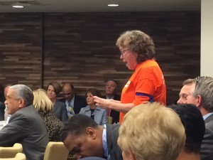 UNC Professor Altha Cravey protesting during the UNC Board of Governors meeting. Photo via Blake Hodge.