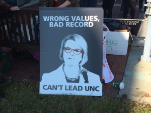 One of many signs at UNC Board of Governors meeting protesting hiring of Margaret Spellings as System President. Photo via Blake Hodge.