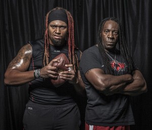 Williams (left) saw his wrestling career take off once he began learning under Booker T (right) in Houston. (Photo via HoustonPress.com)