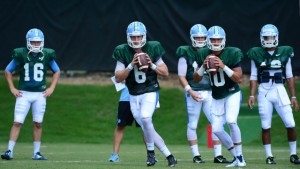 Trubisky (right) has been working on all of the coaches' different schemes during training camp. With Switzer, though, he's been hearing for three years just to throw him the darn ball. (Jeffrey A. Camarati/ UNC Athletics)