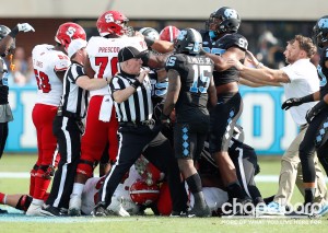 Referees had to separate a skirmish between NC State and UNC during the second quarter. Tar Heel sophomore DT Jalen Dalton was ejected for throwing a punch. (Smith Cameron Photography)