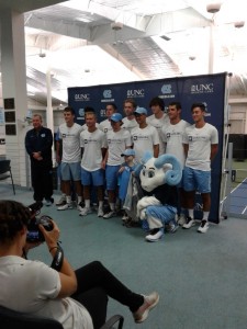Mickey Macholl poses with the UNC Men's Tennis Team and Ramses.