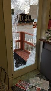 A brick was thrown through the glass door at El Centro. Photo via Facebook.