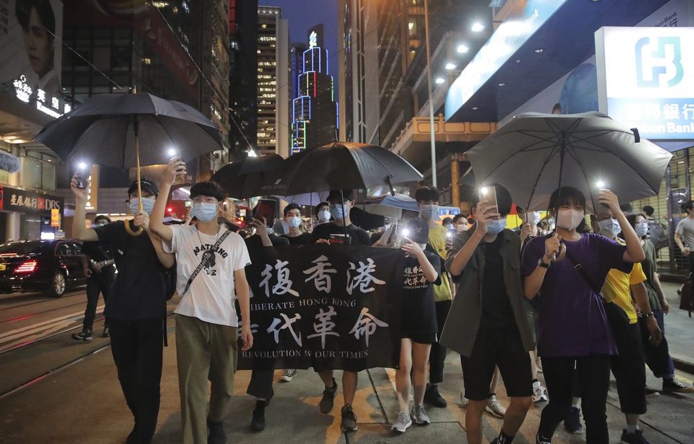 Hundreds March in Hong Kong as Leader Urges Stability
