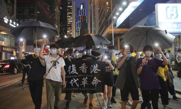 Hundreds March in Hong Kong as Leader Urges Stability
