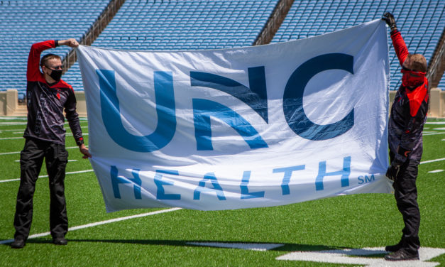 Photo Gallery: Parachute Team Jumps Into Kenan Stadium to Honor UNC Health Workers