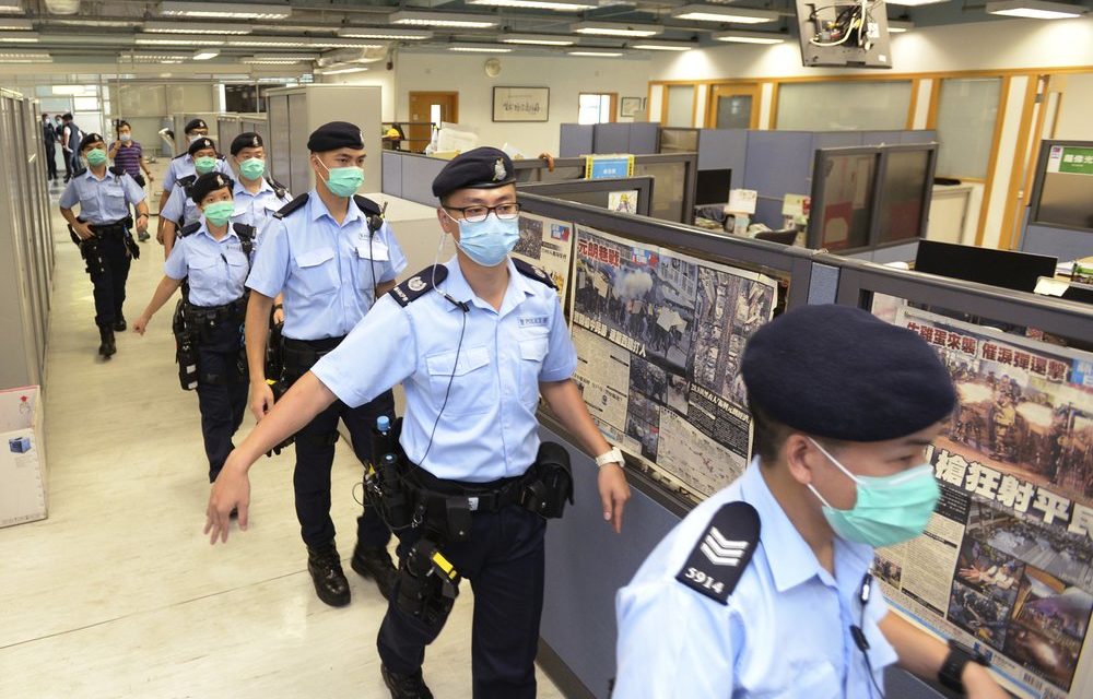 Hong Kong Newspaper Raided, Tycoon Detained Under New Law