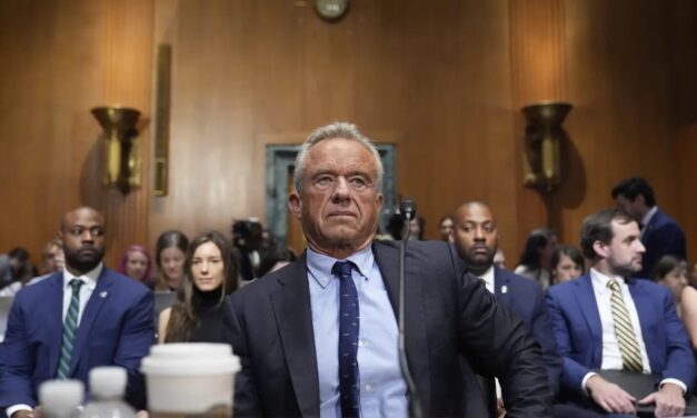 Kennedy Tries To Defend COVID-19 Vaccine Stance in Raucous Senate Hearing