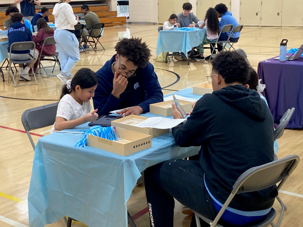UNC Men’s Basketball Collaborates With Elementary Students to Design Warm-Up Shirts